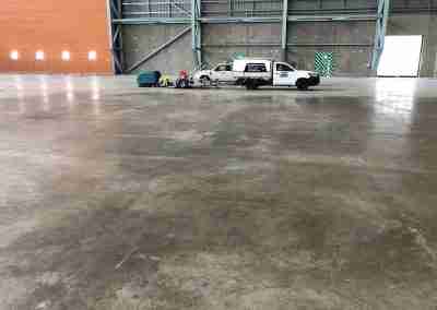 Commercial pressure cleaning ute and cleaning machinery parked in a clean warehouse