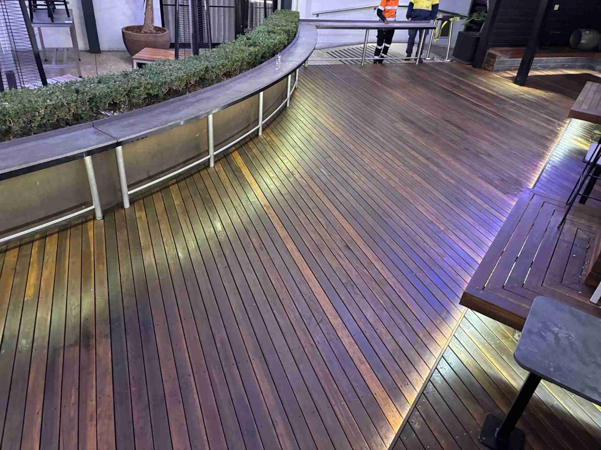 Commercial pressure clean and oil refinish of a beer garden deck